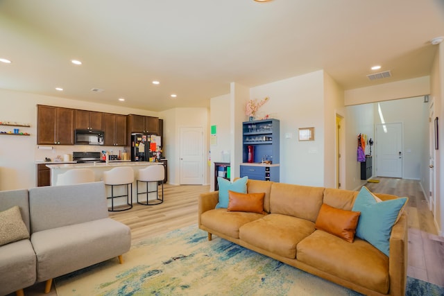 4381 Lauren Loop NE, Rio Rancho, NM 87124 - living room with light wood-style flooring and recessed lighting
