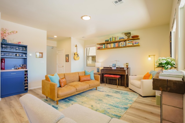4381 Lauren Loop NE, Rio Rancho, NM 87124 - living room with a dry bar, light wood finished floors, and recessed lighting