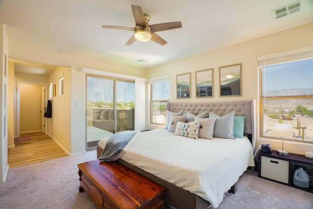 4381 Lauren Loop NE, Rio Rancho, NM 87124 - bedroom with access to exterior, light colored carpet, and a ceiling fan