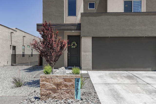4381 Lauren Loop NE, Rio Rancho, NM 87124 - view of front of house featuring stucco siding and driveway