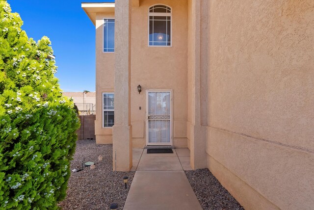 10431 Crosscut Dr NW, Albuquerque, NM 87114 - property entrance with stucco siding