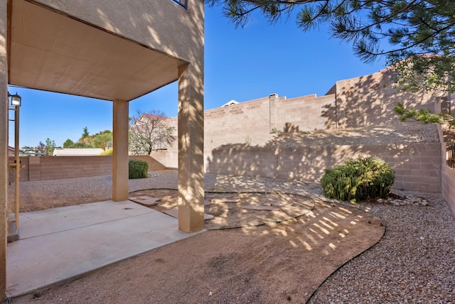 10431 Crosscut Dr NW, Albuquerque, NM 87114 - fenced backyard with a patio area