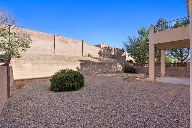 10431 Crosscut Dr NW, Albuquerque, NM 87114 - fenced backyard featuring a patio and a balcony