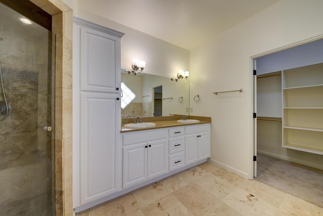 1228 Lafayette Dr NE, Albuquerque, NM 87106 - full bath featuring double vanity, a shower stall, and a walk in closet