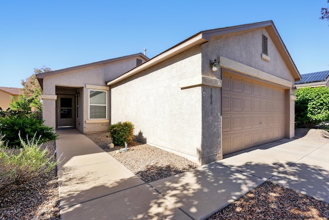10636 Mcmichael Ln SW, Albuquerque, NM 87121 - view of front of home featuring stucco siding, a garage, and driveway