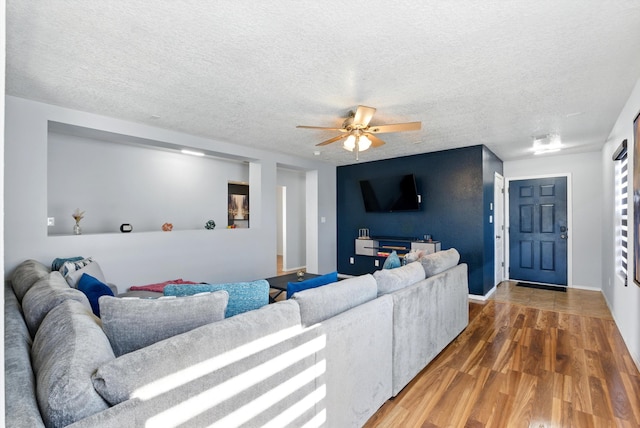 10636 Mcmichael Ln SW, Albuquerque, NM 87121 - living area with wood finished floors, a ceiling fan, and a textured ceiling