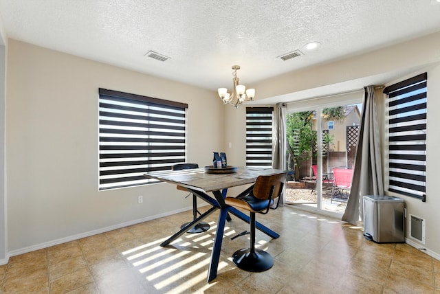 10636 Mcmichael Ln SW, Albuquerque, NM 87121 - dining room with a chandelier and a textured ceiling