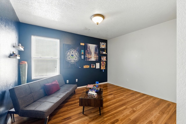 10636 Mcmichael Ln SW, Albuquerque, NM 87121 - living room featuring wood finished floors and a textured ceiling