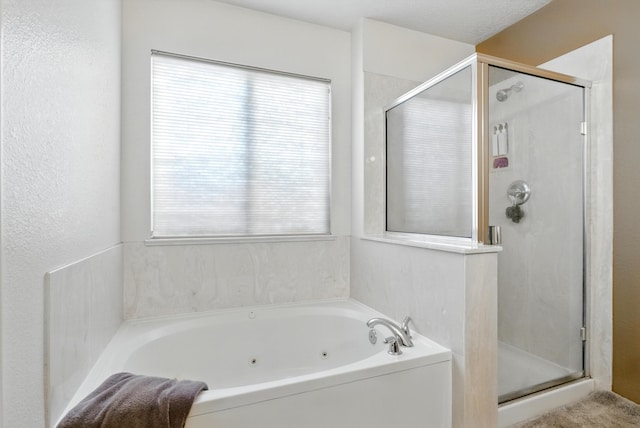 10636 Mcmichael Ln SW, Albuquerque, NM 87121 - bathroom featuring a shower stall and a tub with jets