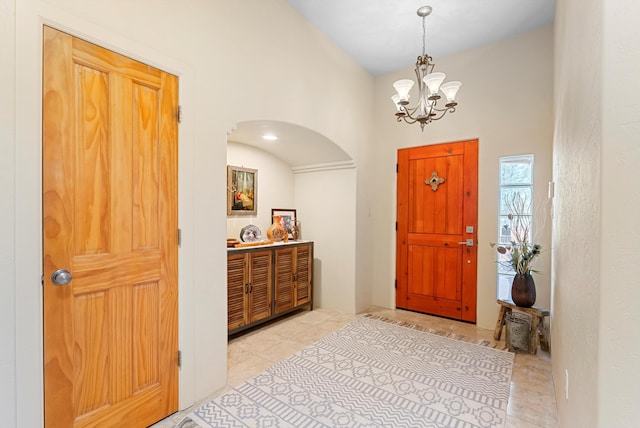 3 Seasons Cir, Placitas, NM 87043 - entryway featuring arched walkways, a chandelier, and light tile patterned floors