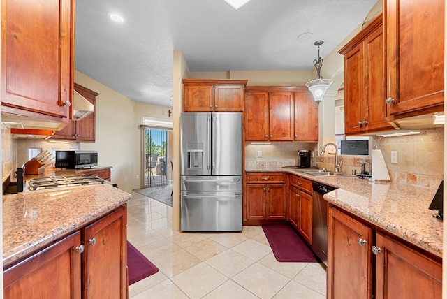 3 Seasons Cir, Placitas, NM 87043 - kitchen featuring stainless steel appliances, brown cabinetry, and light stone counters