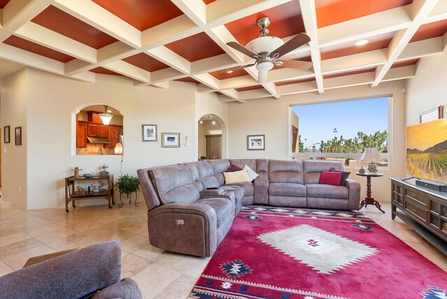 3 Seasons Cir, Placitas, NM 87043 - living room featuring ceiling fan, arched walkways, coffered ceiling, beam ceiling, and light tile patterned floors