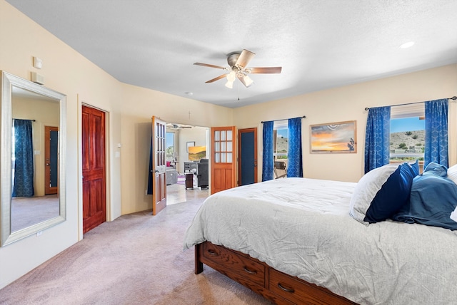 3 Seasons Cir, Placitas, NM 87043 - bedroom with light carpet and a ceiling fan