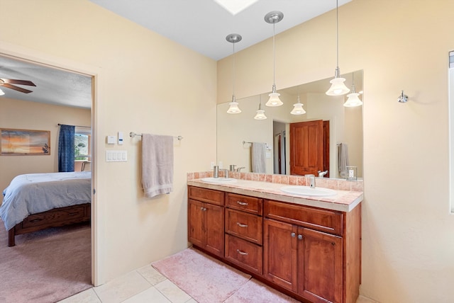 3 Seasons Cir, Placitas, NM 87043 - bathroom with ensuite bathroom, double vanity, ceiling fan, tile patterned floors, and a skylight