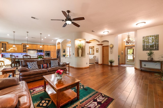 924 Seattle Slew Ave SE, Albuquerque, NM 87112 - living area featuring arched walkways, a ceiling fan, wood-type flooring, a chandelier, and recessed lighting