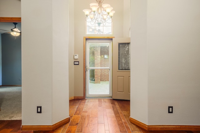 924 Seattle Slew Ave SE, Albuquerque, NM 87112 - entrance foyer with a chandelier, hardwood / wood-style flooring, and a ceiling fan