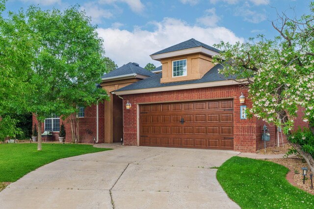 924 Seattle Slew Ave SE, Albuquerque, NM 87112 - traditional-style house featuring concrete driveway, an attached garage, a front lawn, brick siding, and a shingled roof