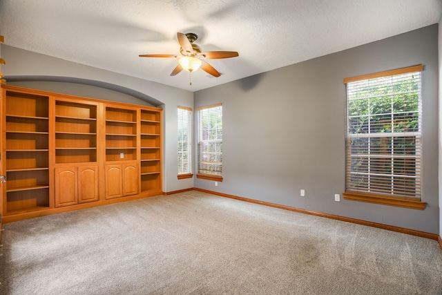 924 Seattle Slew Ave SE, Albuquerque, NM 87112 - empty room featuring a ceiling fan, carpet, healthy amount of natural light, and a textured ceiling