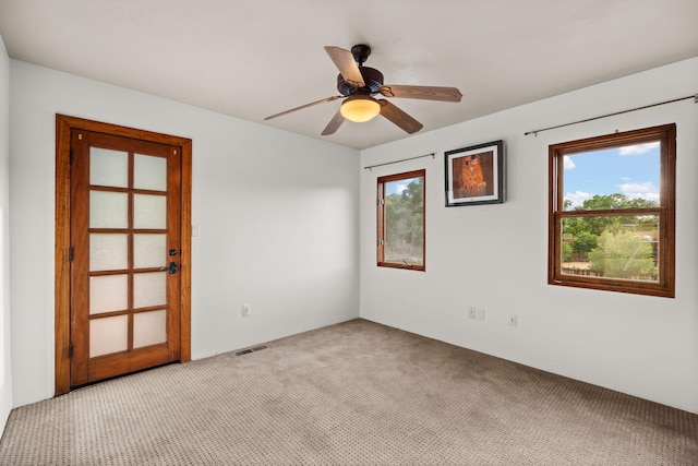 9005 4th St NW, Albuquerque, NM 87114 - empty room with light carpet, plenty of natural light, and ceiling fan