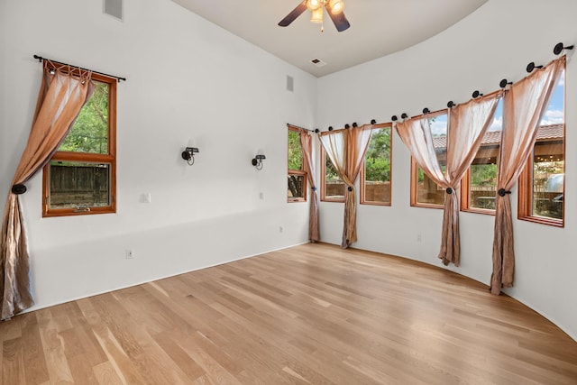 9005 4th St NW, Albuquerque, NM 87114 - unfurnished room with light wood finished floors, ceiling fan, and a towering ceiling