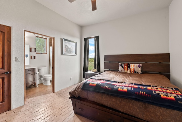 168 Lesperance Rd, Estancia, NM 87016 - bedroom featuring brick floors, ensuite bathroom, and ceiling fan