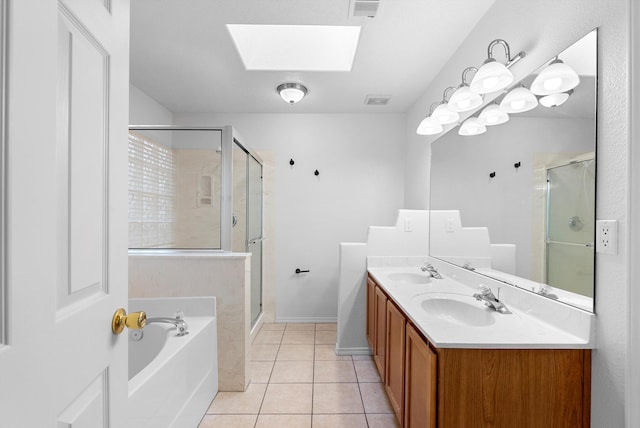 3912 Tundra Swan Ct NW, Albuquerque, NM 87120 - full bathroom with a skylight, a garden tub, a stall shower, double vanity, and tile patterned floors