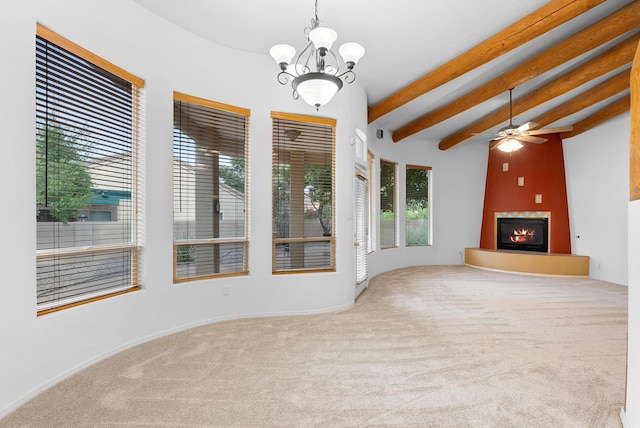 3912 Tundra Swan Ct NW, Albuquerque, NM 87120 - unfurnished living room with carpet, a lit fireplace, beamed ceiling, ceiling fan, and a chandelier