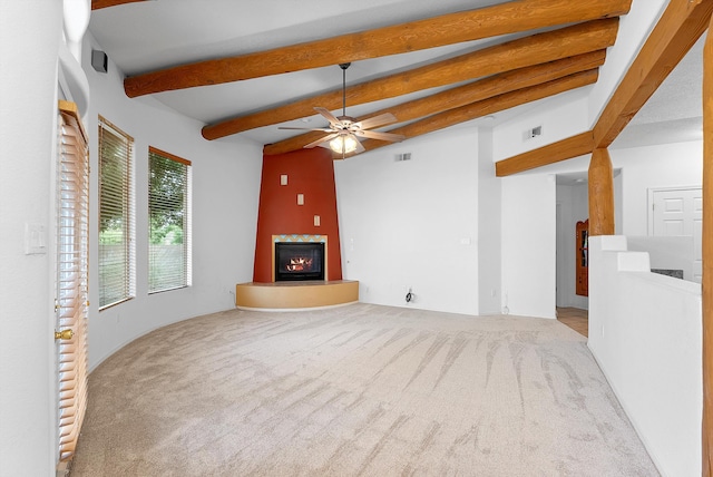 3912 Tundra Swan Ct NW, Albuquerque, NM 87120 - unfurnished living room featuring a glass covered fireplace, carpet floors, beamed ceiling, and ceiling fan