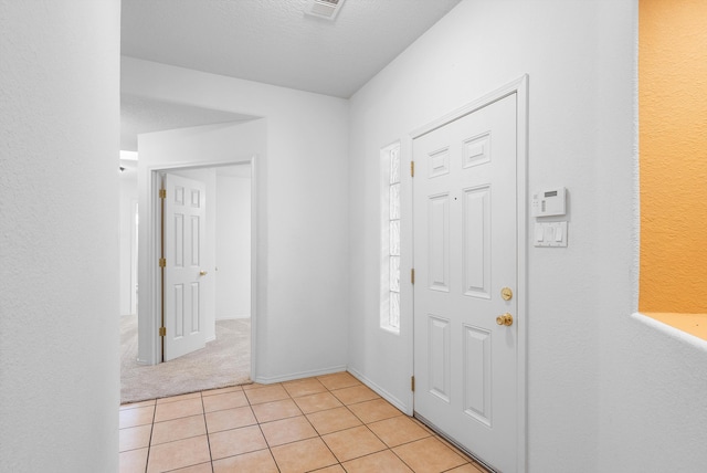 3912 Tundra Swan Ct NW, Albuquerque, NM 87120 - entryway featuring light tile patterned flooring and light carpet