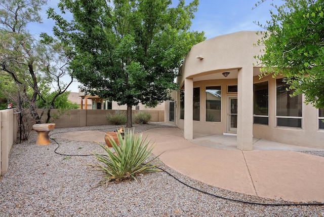 3912 Tundra Swan Ct NW, Albuquerque, NM 87120 - fenced backyard with a patio