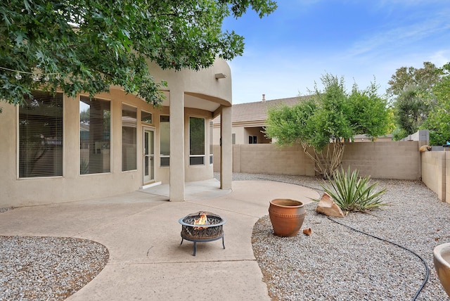 3912 Tundra Swan Ct NW, Albuquerque, NM 87120 - fenced backyard with an outdoor fire pit and a patio area