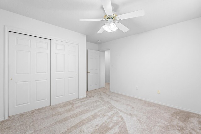 3912 Tundra Swan Ct NW, Albuquerque, NM 87120 - unfurnished bedroom featuring carpet flooring, a closet, and a ceiling fan