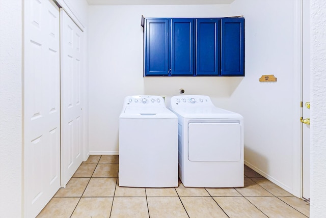 3912 Tundra Swan Ct NW, Albuquerque, NM 87120 - washroom with cabinet space, separate washer and dryer, and light tile patterned flooring
