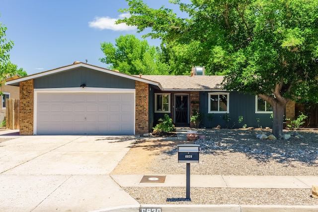 6920 Conestoga Dr NW, Albuquerque, NM 87120 - ranch-style house featuring brick siding, an attached garage, and concrete driveway