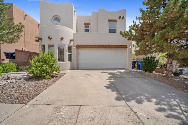 7132 Calle Alegria Ave NE, Albuquerque, NM 87113 - adobe home featuring stucco siding, driveway, and an attached garage