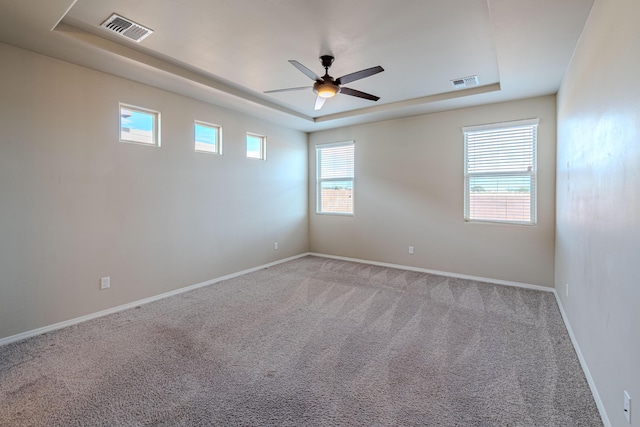 4289 Crowned Eagle Loop NE, Rio Rancho, NM 87144 - spare room with a tray ceiling, carpet, and ceiling fan