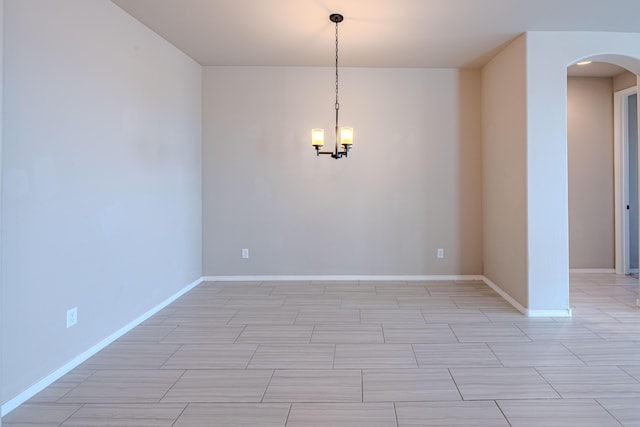4289 Crowned Eagle Loop NE, Rio Rancho, NM 87144 - unfurnished room featuring arched walkways and a chandelier