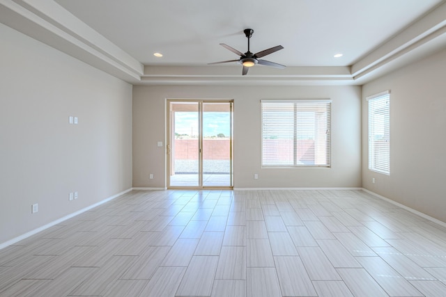 4289 Crowned Eagle Loop NE, Rio Rancho, NM 87144 - spare room featuring a tray ceiling, a ceiling fan, recessed lighting, and light wood-style flooring