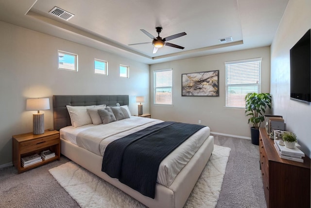 4289 Crowned Eagle Loop NE, Rio Rancho, NM 87144 - carpeted bedroom with a tray ceiling and a ceiling fan