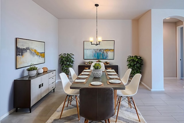 4289 Crowned Eagle Loop NE, Rio Rancho, NM 87144 - dining room with arched walkways, a chandelier, and light tile patterned flooring