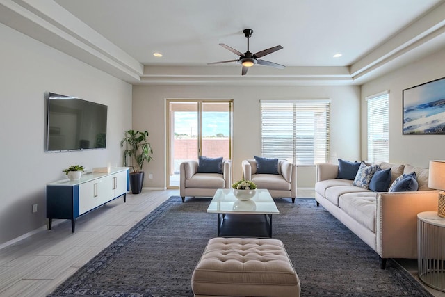 4289 Crowned Eagle Loop NE, Rio Rancho, NM 87144 - living area featuring a raised ceiling, a ceiling fan, recessed lighting, and light wood-type flooring