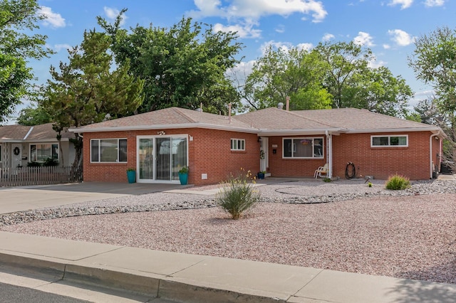 2717 Mesilla St NE, Albuquerque, NM 87110 - ranch-style home with brick siding and roof with shingles