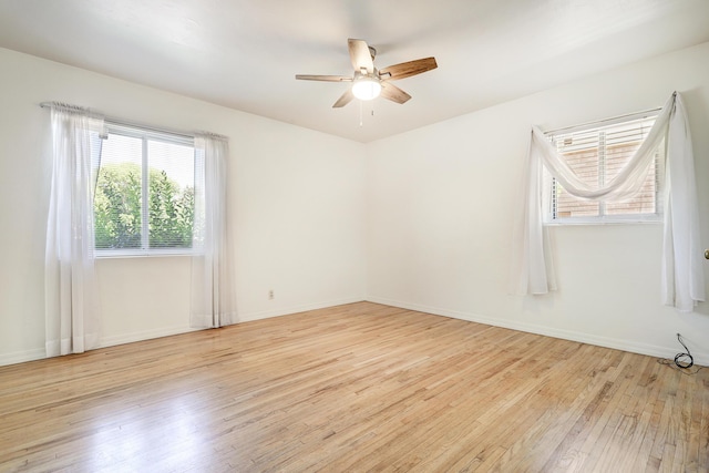 2600 Virginia St NE, Albuquerque, NM 87110 - spare room with hardwood / wood-style flooring and ceiling fan