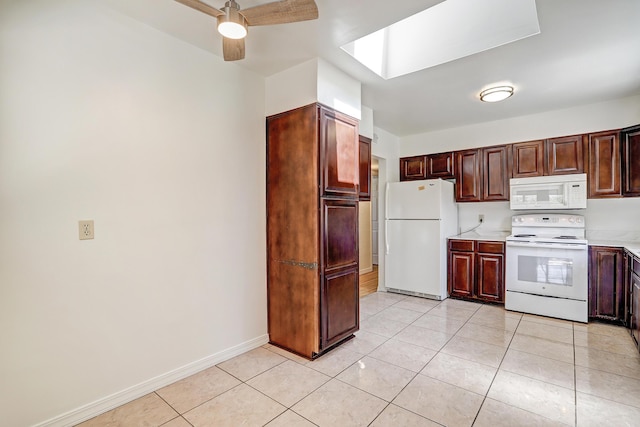 2600 Virginia St NE, Albuquerque, NM 87110 - kitchen with white appliances, light countertops, ceiling fan, and light tile patterned flooring