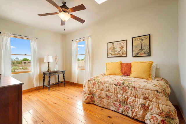651 Calle De Blas, Corrales, NM 87048 - bedroom featuring multiple windows, light wood-style floors, and ceiling fan