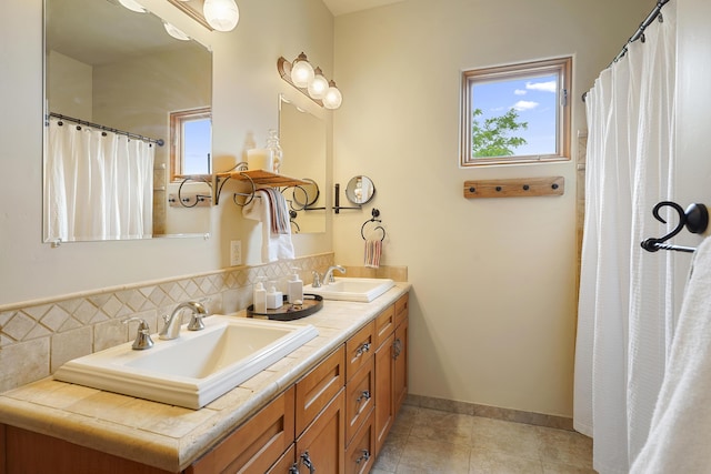 651 Calle De Blas, Corrales, NM 87048 - full bathroom with double vanity, plenty of natural light, tile patterned floors, and a shower with shower curtain