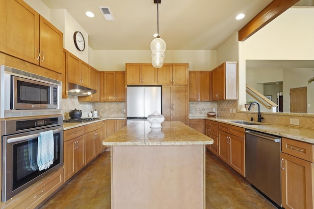 651 Calle De Blas, Corrales, NM 87048 - kitchen with appliances with stainless steel finishes, concrete flooring, decorative backsplash, under cabinet range hood, and recessed lighting