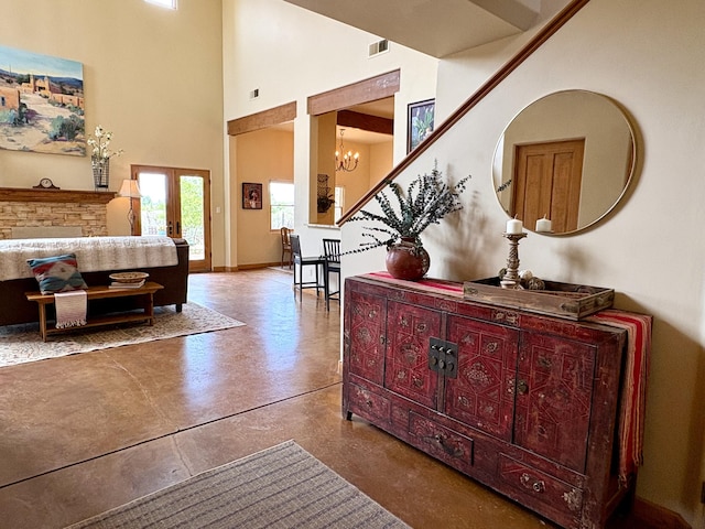651 Calle De Blas, Corrales, NM 87048 - hall with finished concrete flooring, a towering ceiling, a chandelier, and stairway