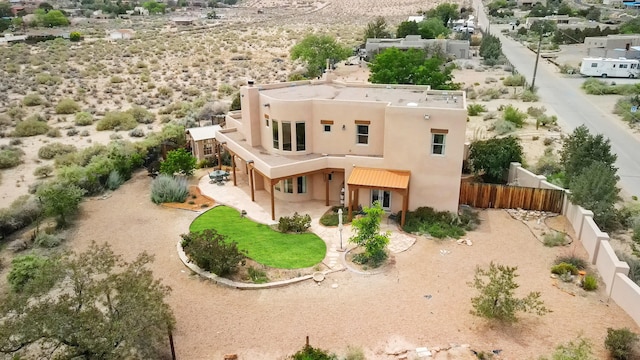 651 Calle De Blas, Corrales, NM 87048 - back of property with stucco siding, a fenced backyard, and a patio