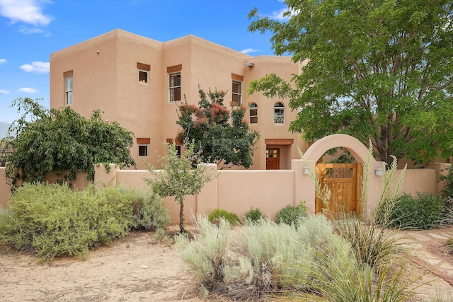 651 Calle De Blas, Corrales, NM 87048 - view of front of property with a gate and stucco siding